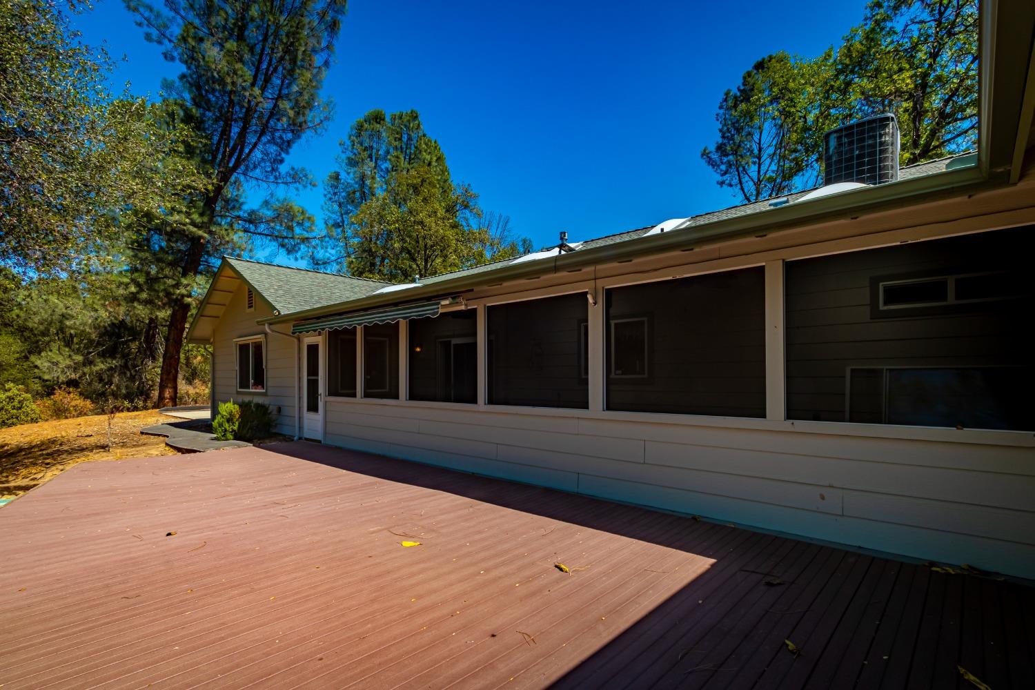 49709 Meadowview Drive Oakhurst, CA 93644 - Photo 47 of 59 a view of a house with a backyard