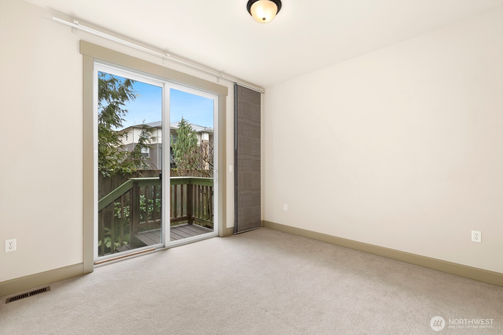 2115 201st Place Southeast, Unit H3 Bothell, WA 98012 - Photo 12 of 37 a view of an empty room with sliding glass door