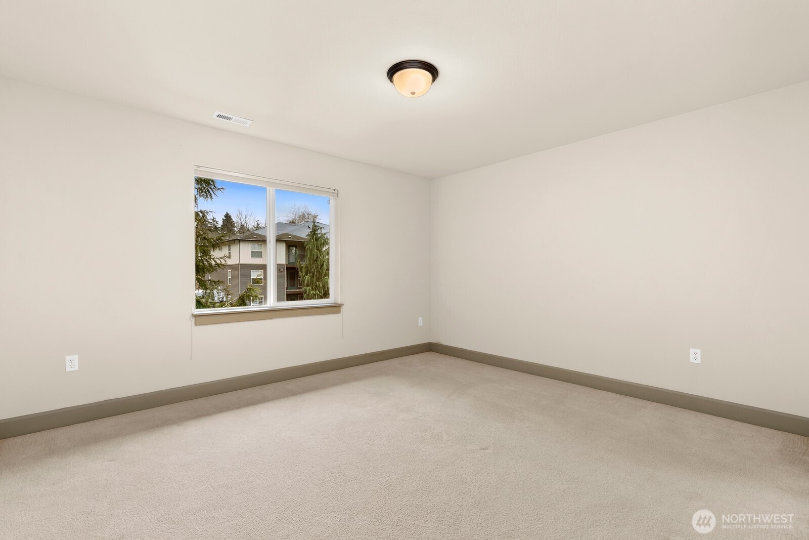 2115 201st Place Southeast, Unit H3 Bothell, WA 98012 - Photo 21 of 37 a view of an empty room with a window