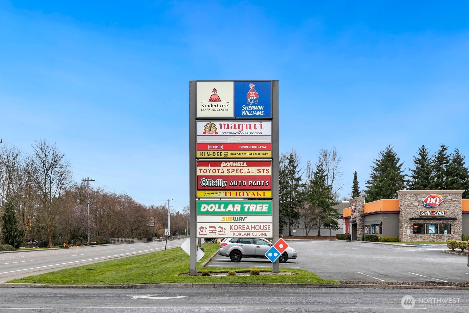 2115 201st Place Southeast, Unit H3 Bothell, WA 98012 - Photo 35 of 37 a picture of a brick building with a bench in front of it
