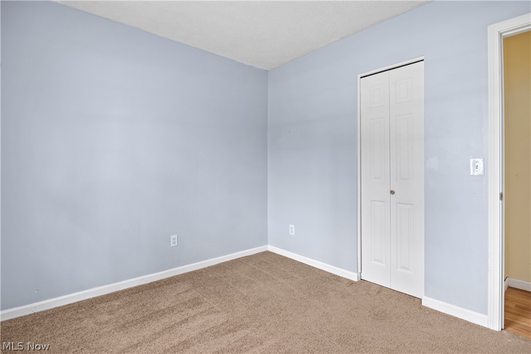 34067 Bainbridge Road North Ridgeville, OH 44039 - Photo 26 of 33 Unfurnished bedroom with carpet and a closet