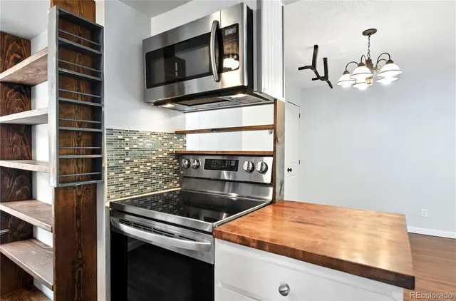 a kitchen with a stove and a microwave