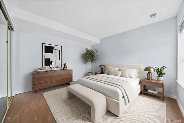 a living room with furniture a table and a window