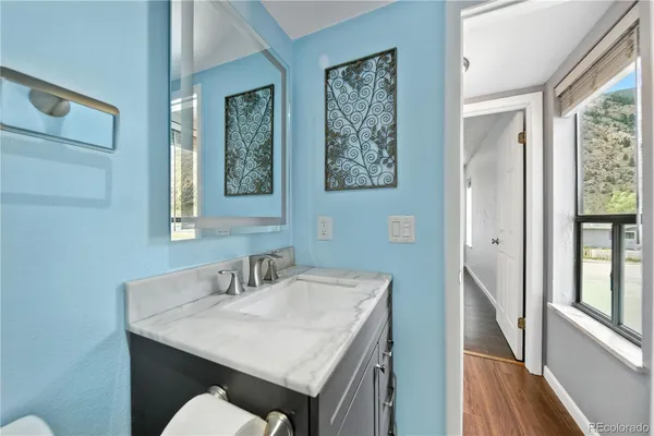 a bathroom with a sink and a mirror
