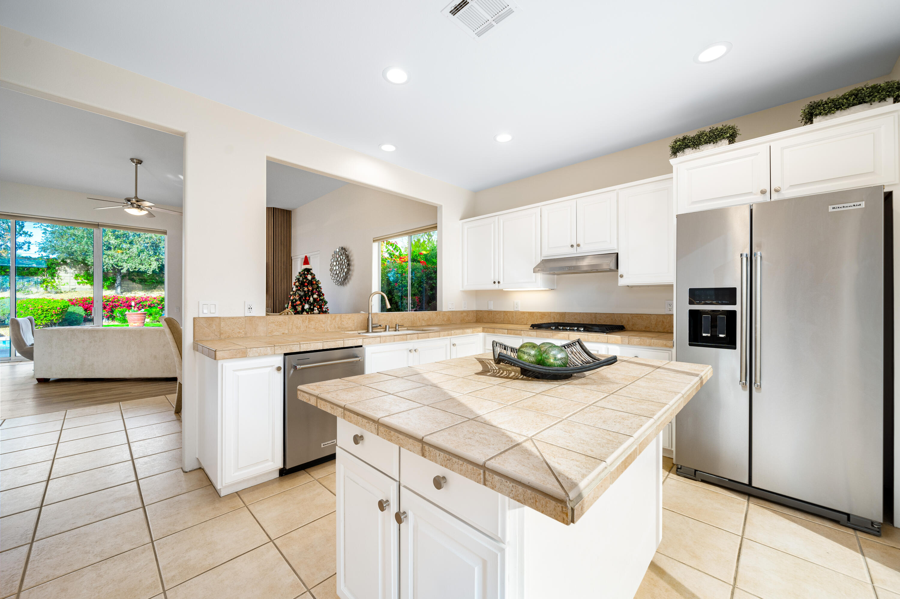79060 River Rock Road La Quinta, CA 92253 - Photo 13 of 36 a kitchen with a sink a stove and refrigerator