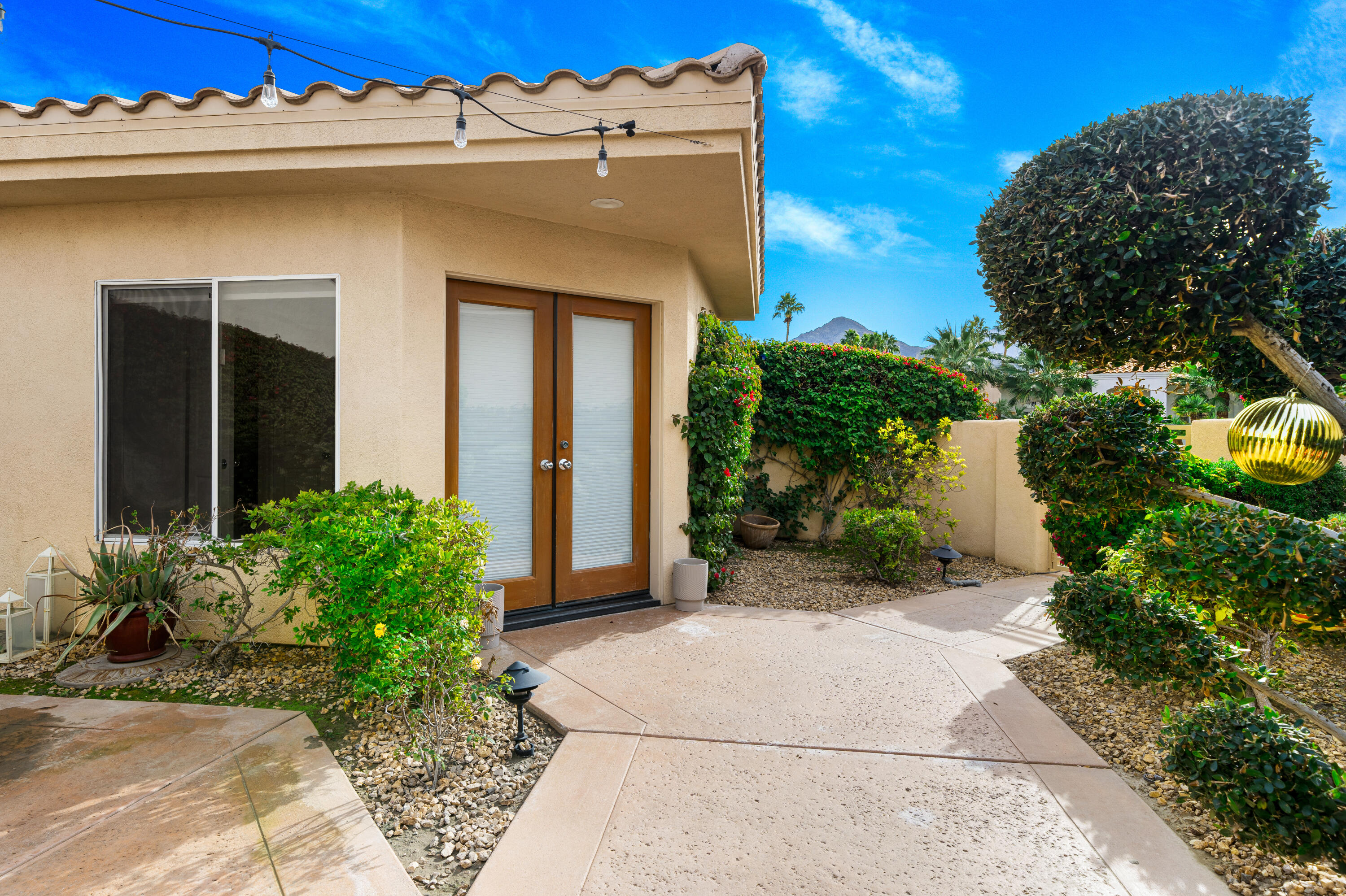 79060 River Rock Road La Quinta, CA 92253 - Photo 25 of 36 a view of a house with potted plants