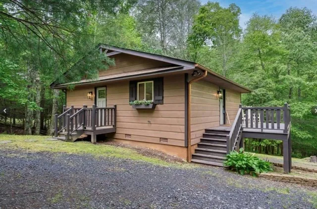 a front view of a house with garden