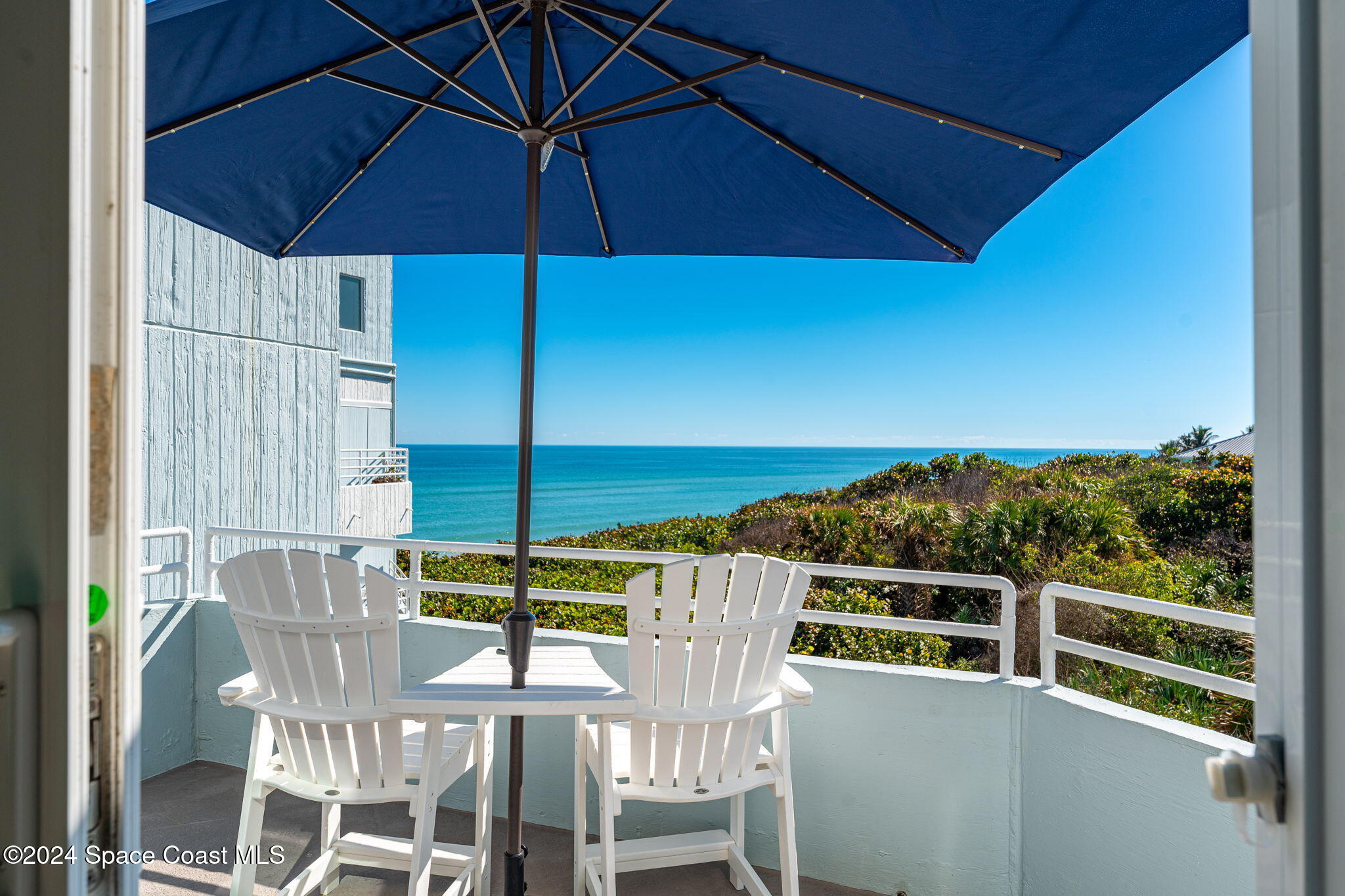 6355 South Hwy A1A, Unit 5 Melbourne Beach, FL 32951 - Photo 15 of 37 a view of a chairs and table in the balcony