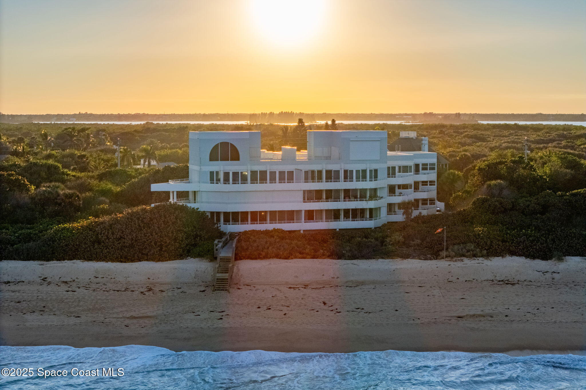 6355 South Hwy A1A, Unit 5 Melbourne Beach, FL 32951 - Photo 2 of 37 a view of buildings with ocean view