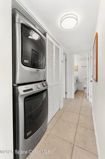 a view of a hallway with washer and dryer