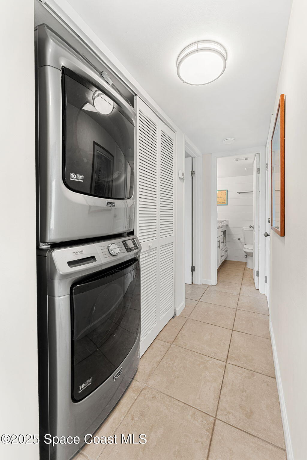 6355 South Hwy A1A, Unit 5 Melbourne Beach, FL 32951 - Photo 24 of 37 a view of a hallway with washer and dryer