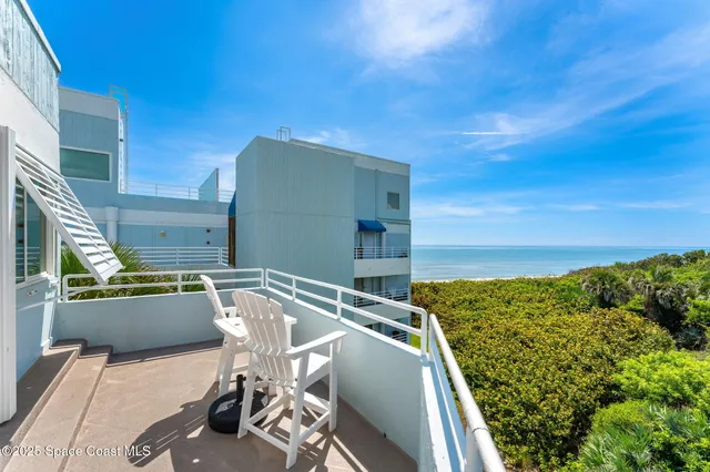 a view of balcony with chairs