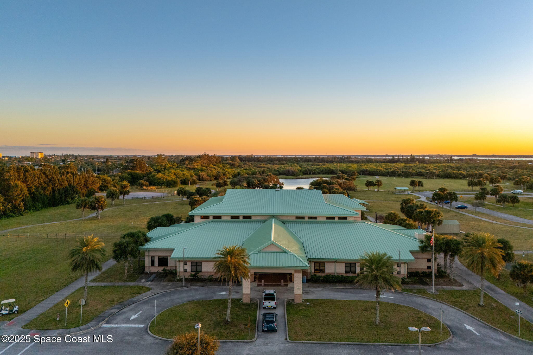 6355 South Hwy A1A, Unit 5 Melbourne Beach, FL 32951 - Photo 34 of 37 an aerial view of a house with swimming pool and lake view