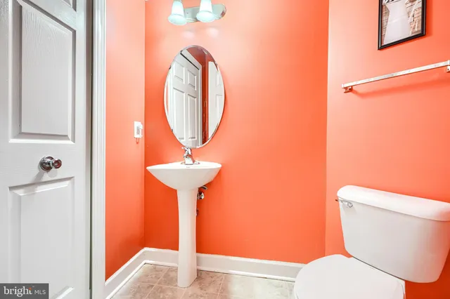 a bathroom with a toilet and a sink