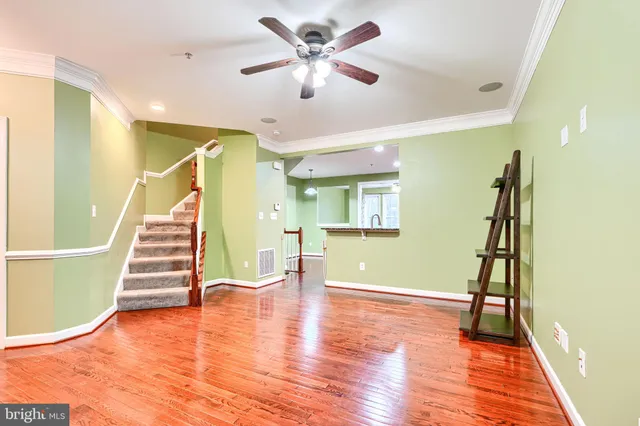 a view of an entryway with wooden floor