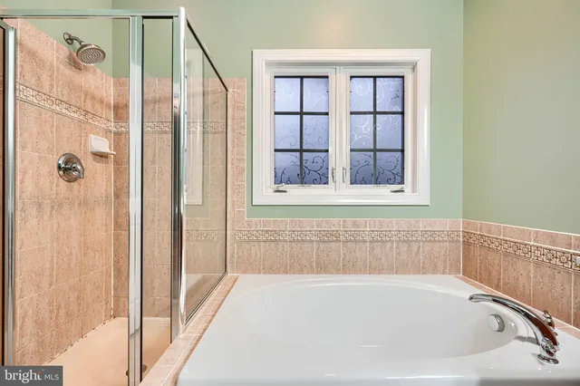 a view of empty room with a fireplace