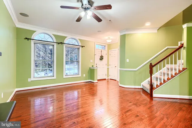 a view of an entryway with wooden floor