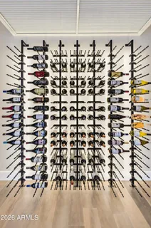 a living room with furniture a rug and white walls