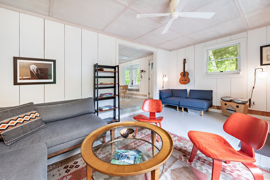 1680 C Drift Road Westport, MA 02790 - Photo 18 of 36 a living room with furniture a rug and white walls
