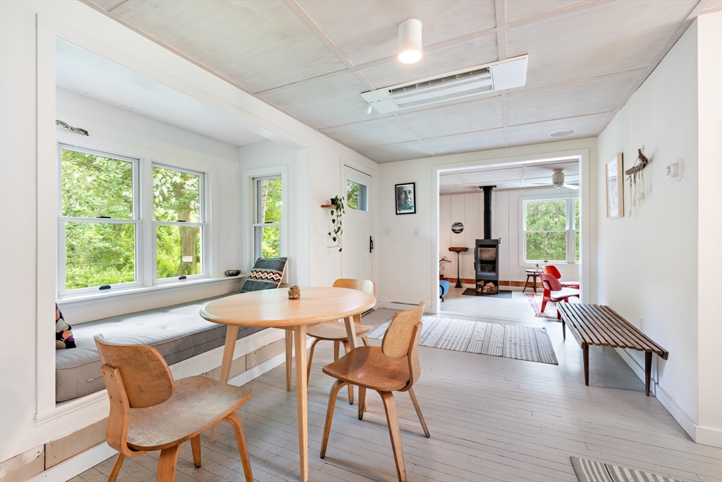 1680 C Drift Road Westport, MA 02790 - Photo 19 of 36 a view of a dining room with furniture window and wooden floor