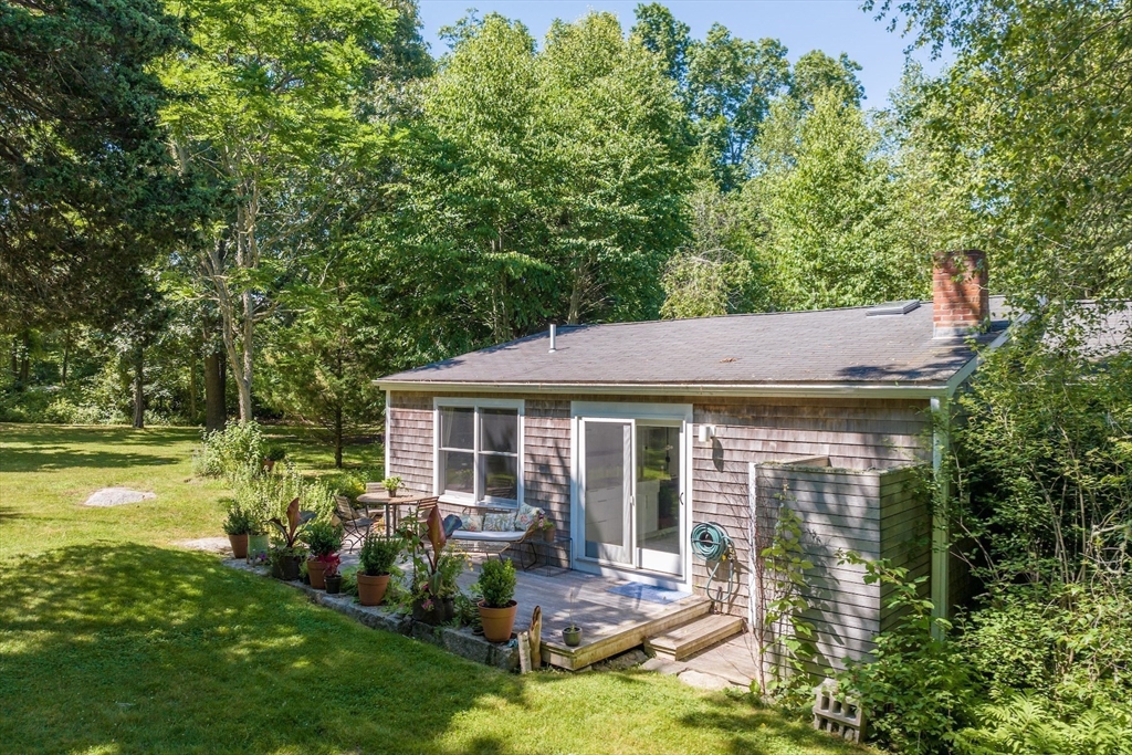 1680 C Drift Road Westport, MA 02790 - Photo 2 of 36 a view of a house with backyard porch and patio