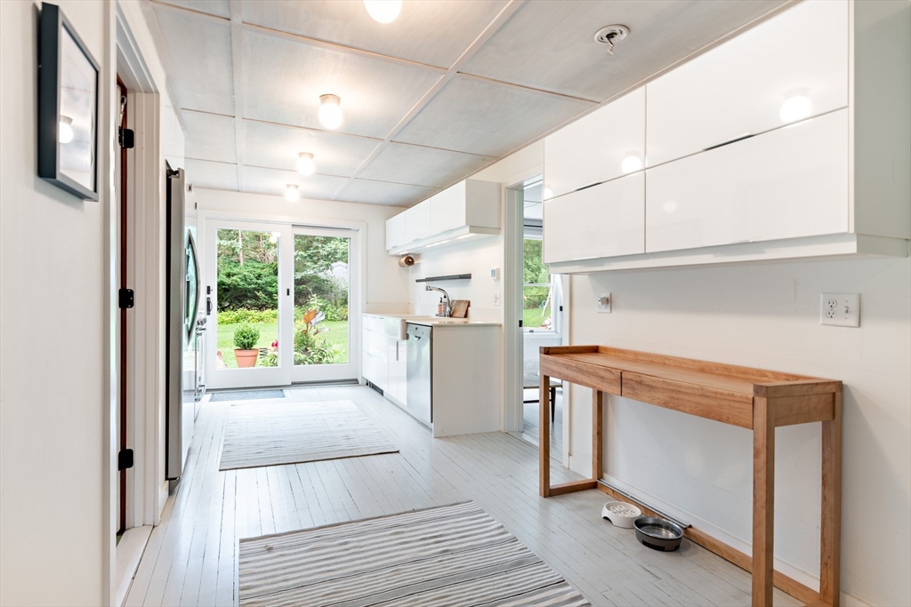 1680 C Drift Road Westport, MA 02790 - Photo 21 of 36 a kitchen with a refrigerator a stove and a cabinets