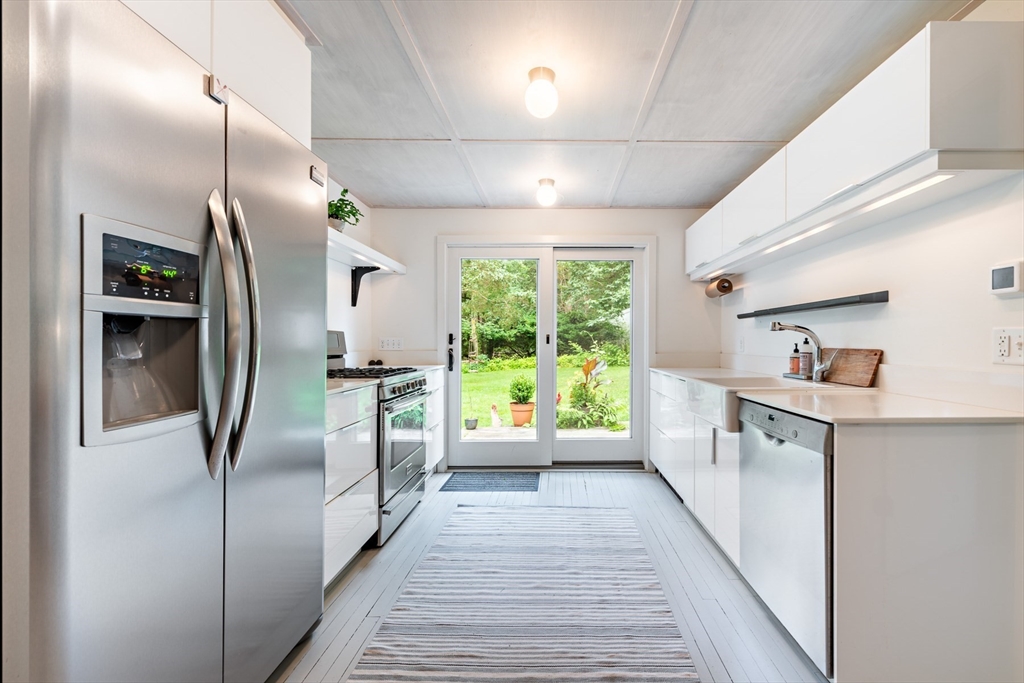 1680 C Drift Road Westport, MA 02790 - Photo 22 of 36 a kitchen with stainless steel appliances a refrigerator and a sink