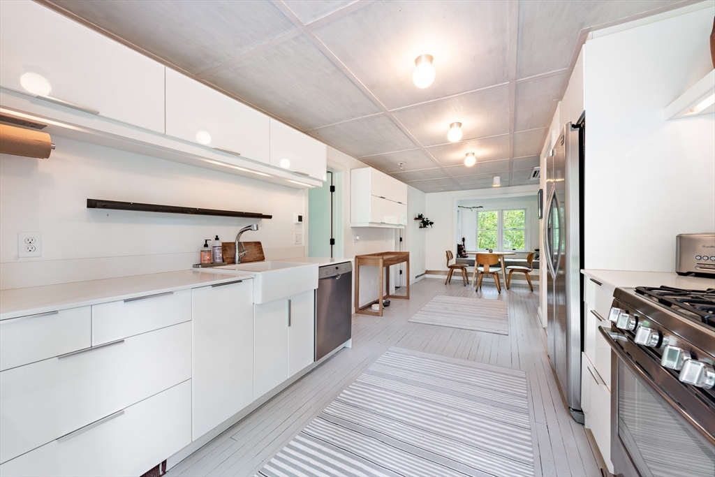 1680 C Drift Road Westport, MA 02790 - Photo 23 of 36 a open kitchen with stainless steel appliances granite countertop a lot of counter space and a refrigerator