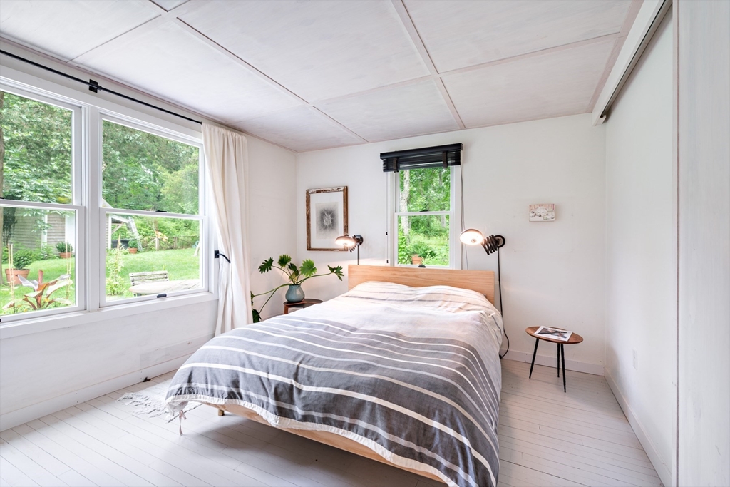 1680 C Drift Road Westport, MA 02790 - Photo 24 of 36 a bedroom with a large bed and a window