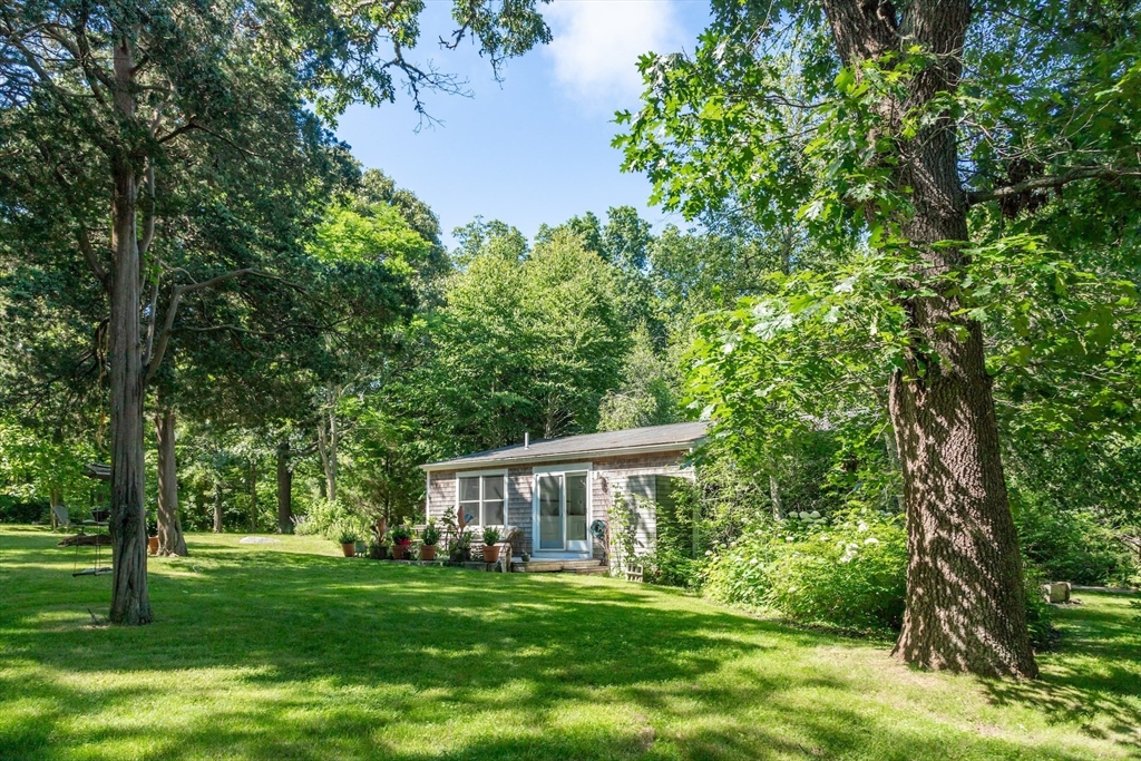 1680 C Drift Road Westport, MA 02790 - Photo 34 of 36 a front view of a house with a garden