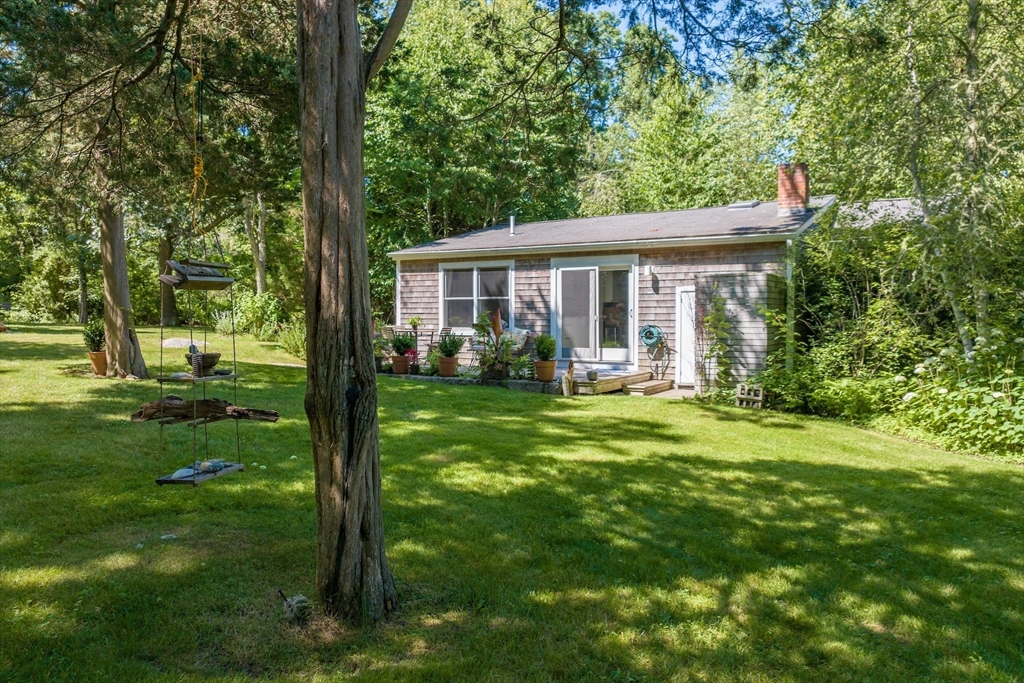 1680 C Drift Road Westport, MA 02790 - Photo 5 of 36 a view of a house with a backyard and a patio