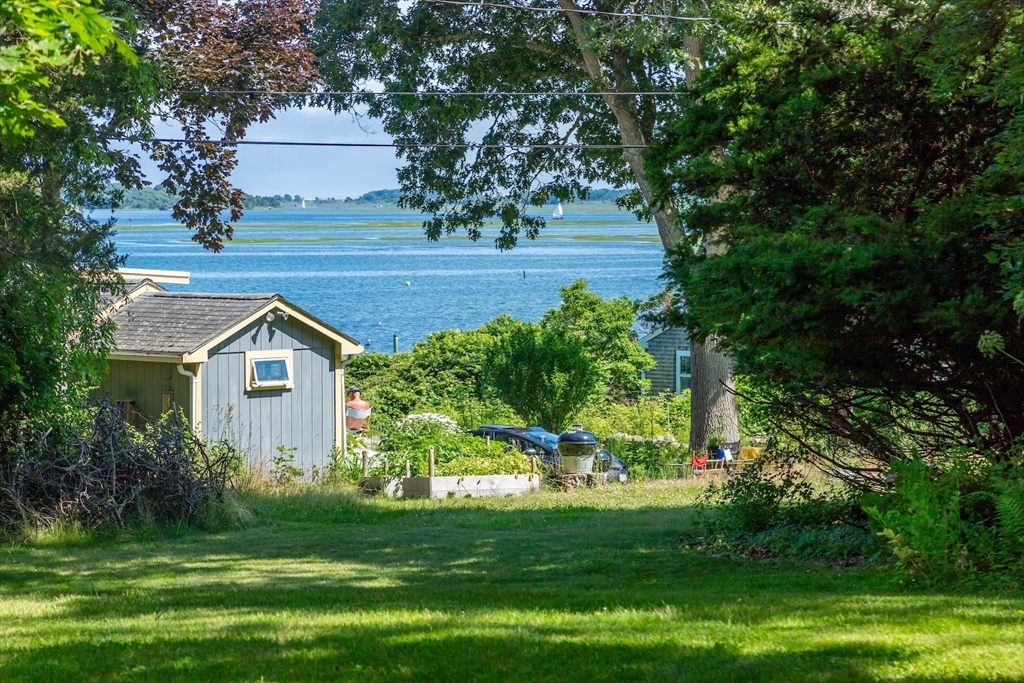 1680 C Drift Road Westport, MA 02790 - Photo 10 of 36 a front view of a house with a garden
