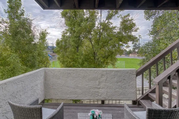 a view of balcony with furniture