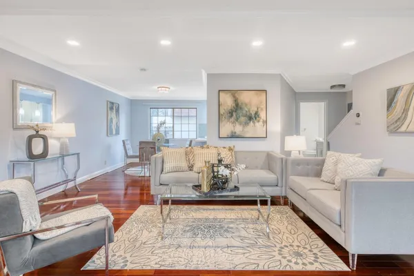 a living room with furniture or couch and a dining table