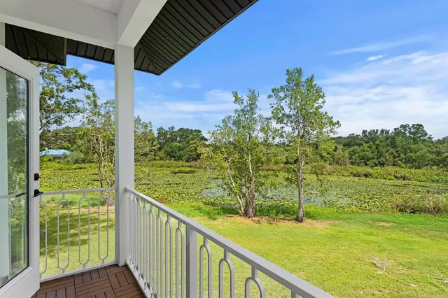 a view of a garden from a balcony
