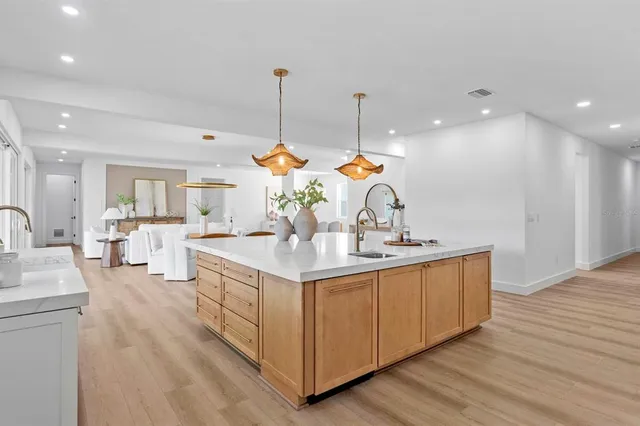 a kitchen with counter top space and sink