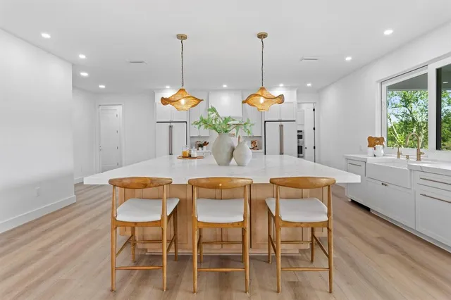 a dining room filled with furniture and window