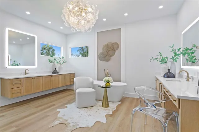 a living room with furniture a window and a mirror