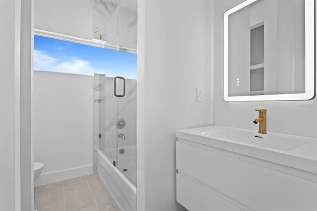 a bathroom with a sink and a shower
