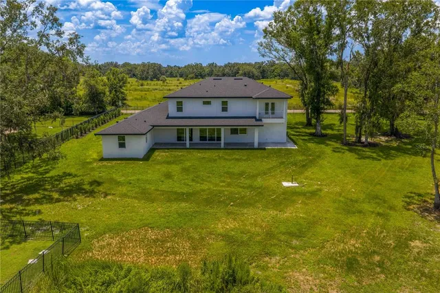 a view of a house with a big yard