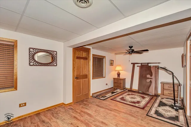 a view of kitchen with stainless steel appliances wooden floor