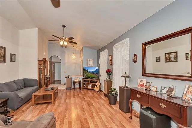 a living room with furniture and wooden floor