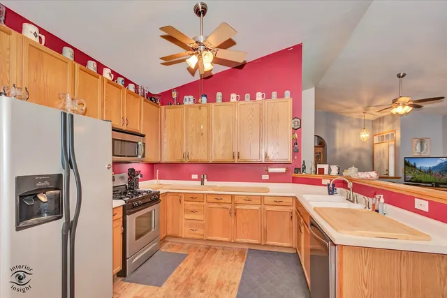 a kitchen with a sink stove and refrigerator