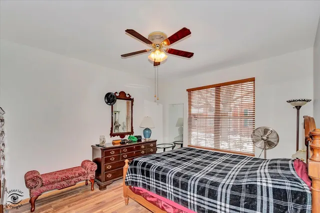 a bedroom with bed and a window