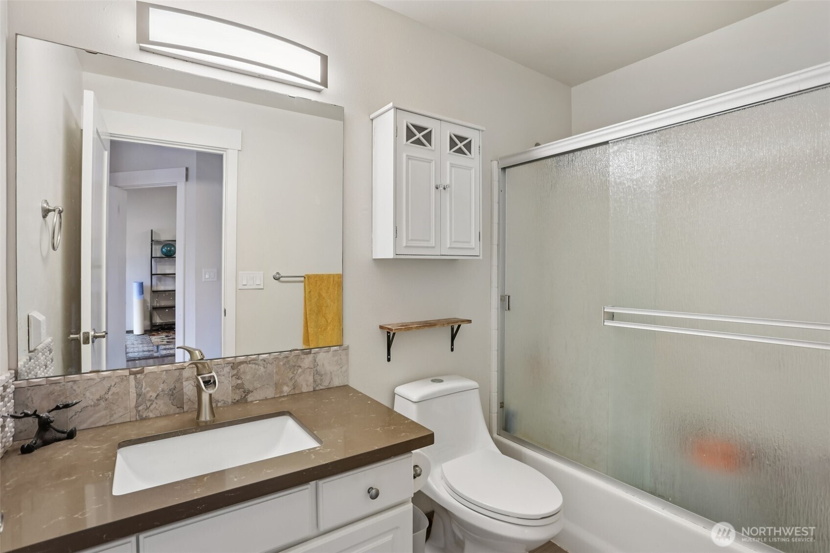 2009 196th Street Southeast, Unit E302 Bothell, WA 98012 - Photo 12 of 21 a bathroom with a sink a toilet and shower