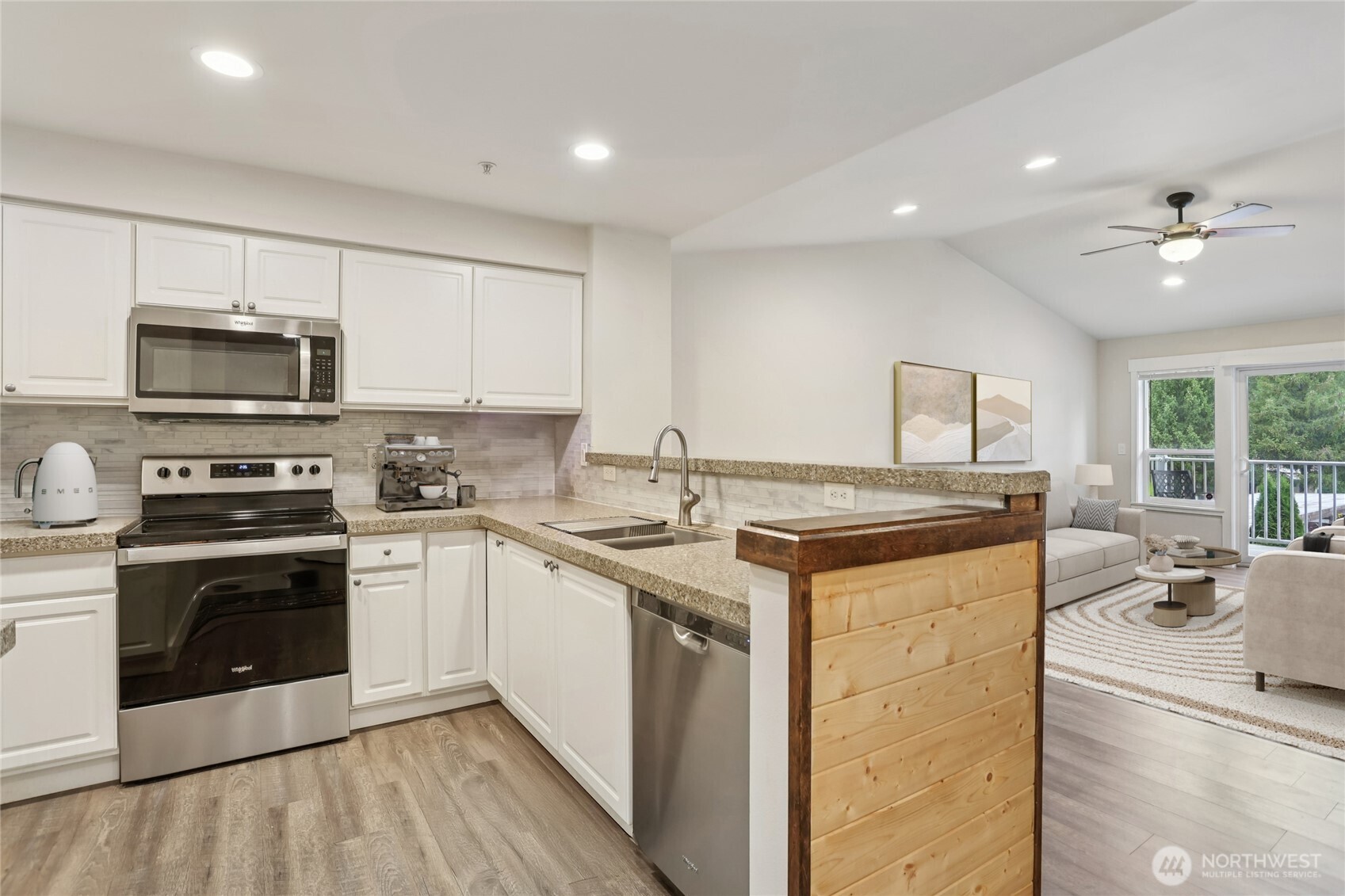 2009 196th Street Southeast, Unit E302 Bothell, WA 98012 - Photo 3 of 21 a kitchen with a stove and a sink