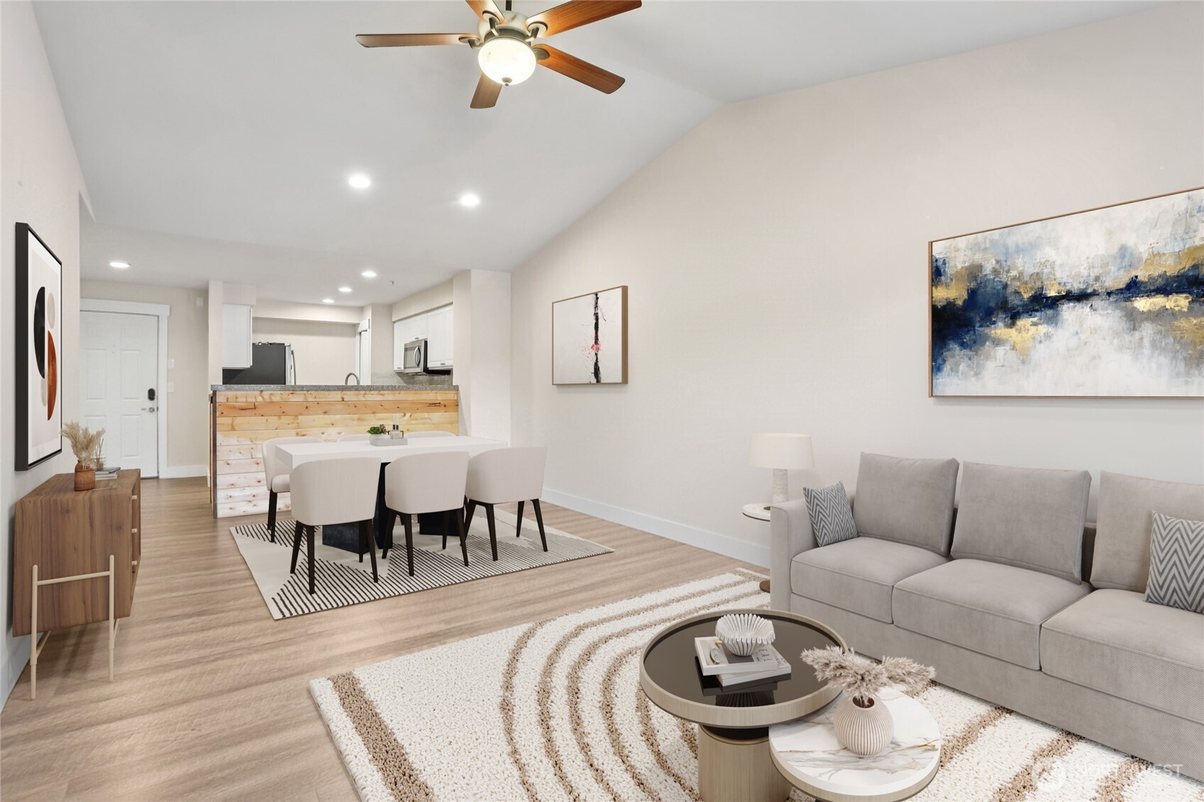 2009 196th Street Southeast, Unit E302 Bothell, WA 98012 - Photo 9 of 21 a living room with furniture and a dining table with wooden floor
