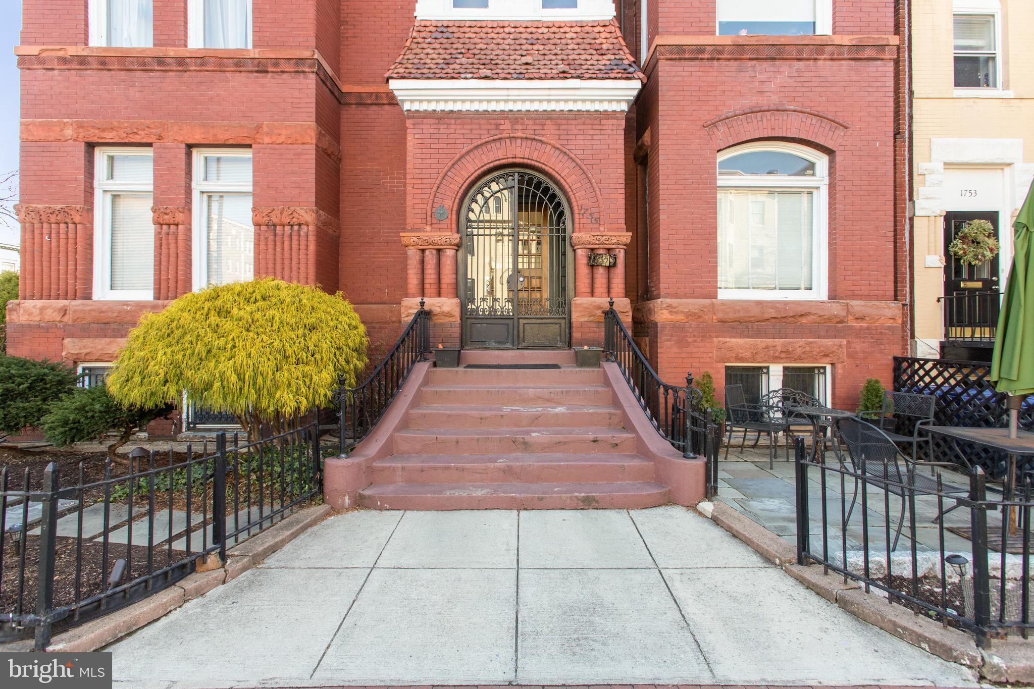 1755 18th Street Northwest, Unit 101 Washington, DC 20009 - Photo 16 of 17 a view of a brick house with large windows
