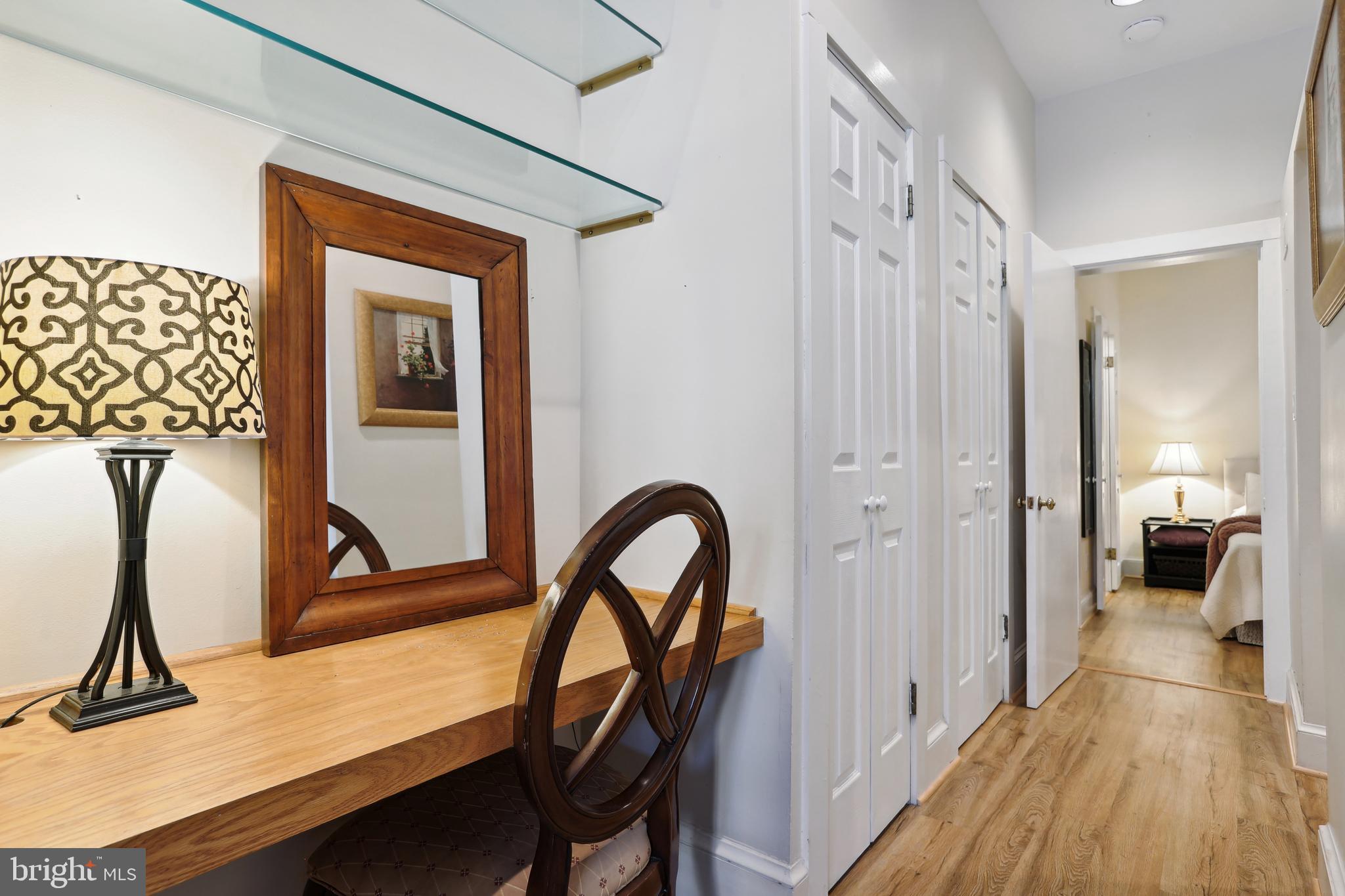 1755 18th Street Northwest, Unit 101 Washington, DC 20009 - Photo 6 of 17 a view of a hallway with wooden floor and furniture