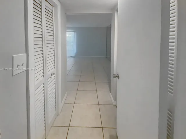 a view of a pathway with a yard